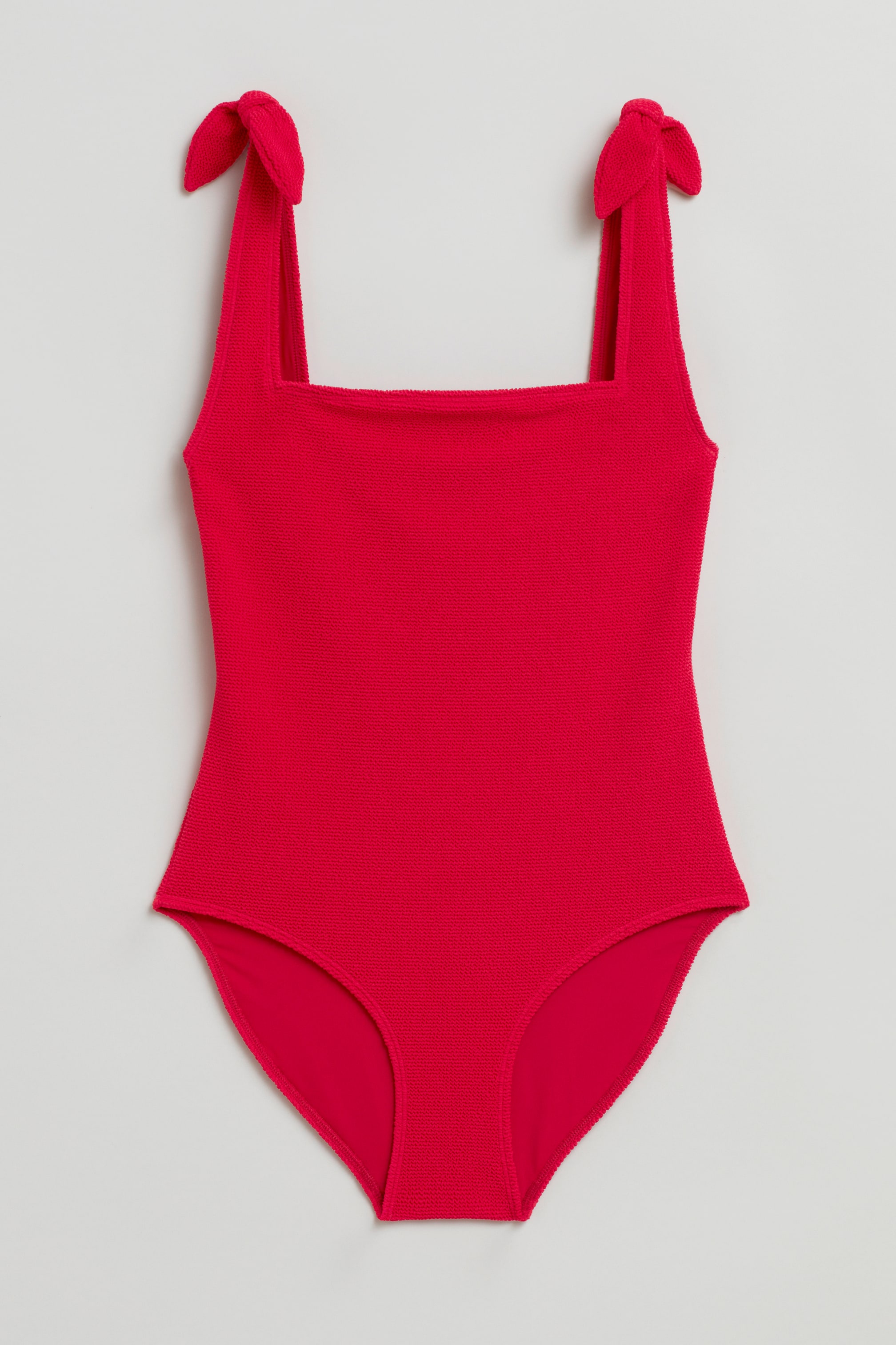 Ver imagen más grande: Traje de baño con lazo texturizado - Ruby red - MUJER | H&M ES 1