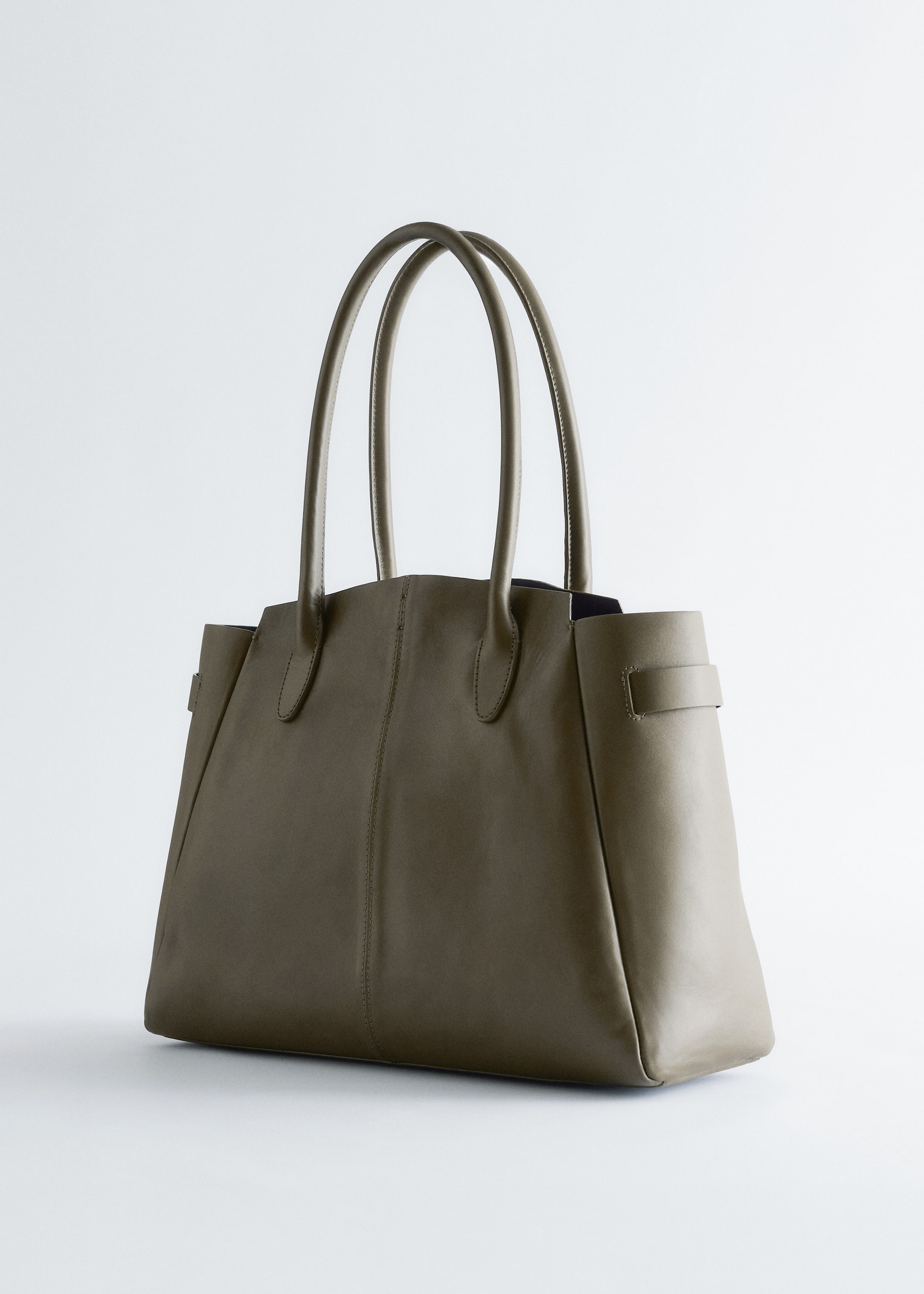 View larger image: An olive green tote bag is featured, showcasing a smooth, matte material. It is designed with two arched top handles and side gussets, which are secured by a horizontal strap detail on each side.