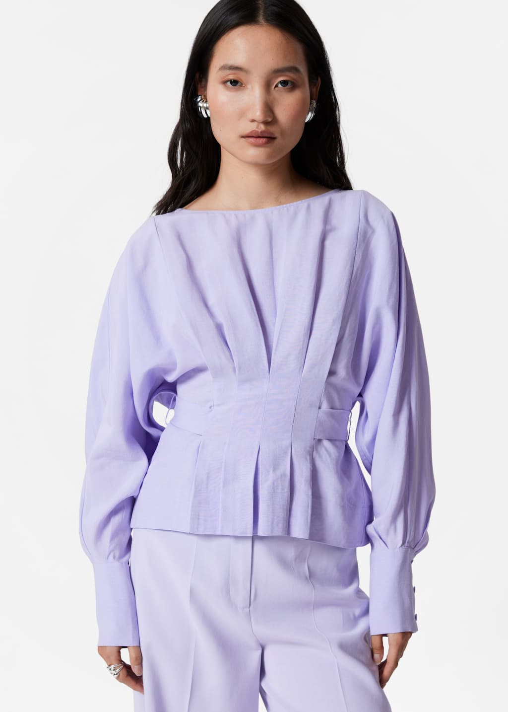 Image of Blusa plisada de cuello barco