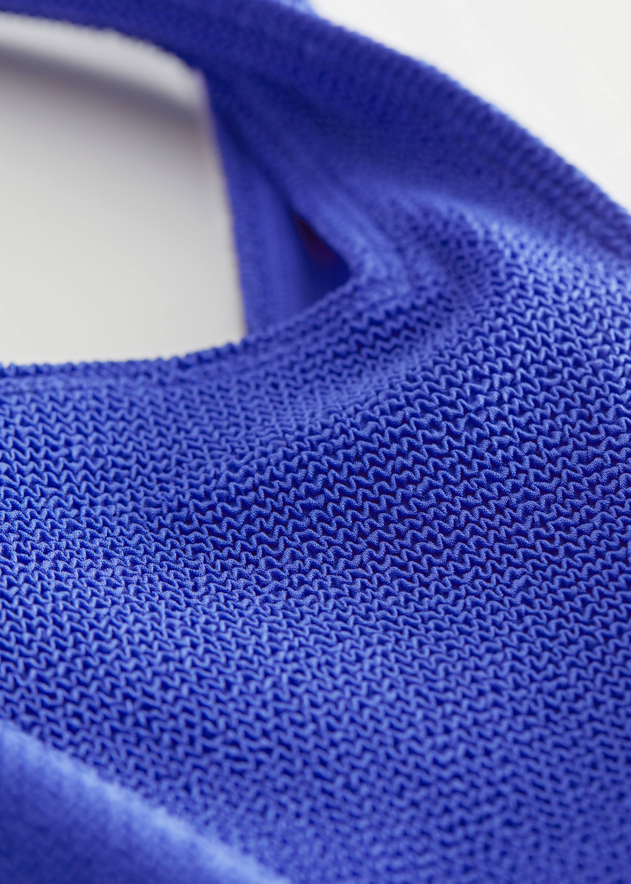 Textured Bow Tie Swimsuit - {{variantName}} - Detalle descriptivo
