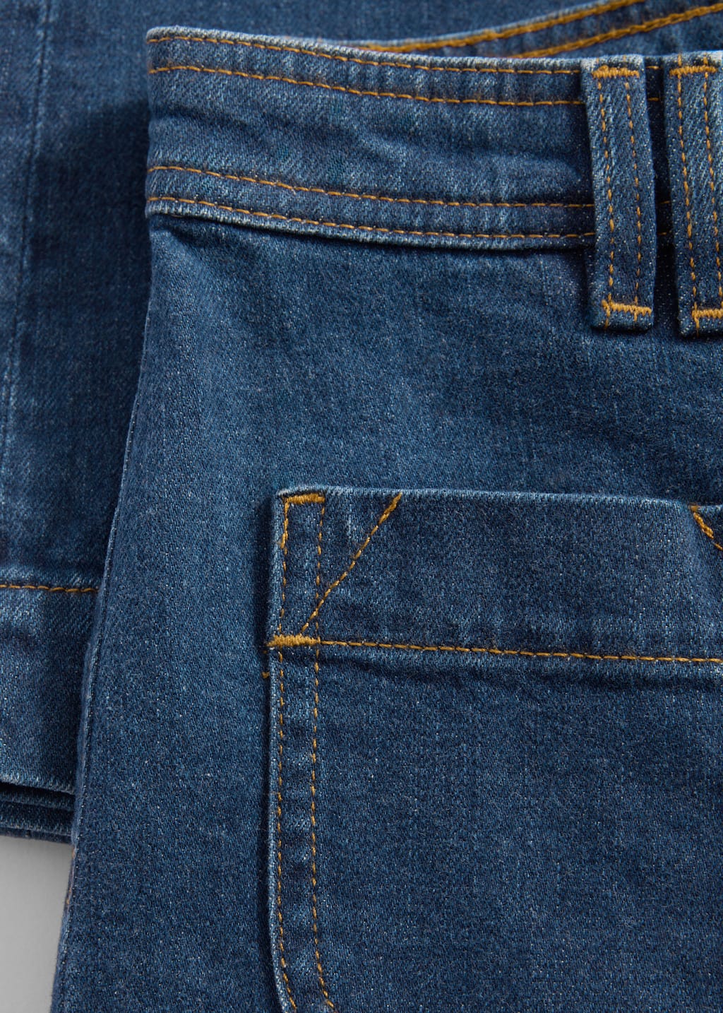 High-Waist Flared Jeans - {{variantName}} - Descriptive Detail