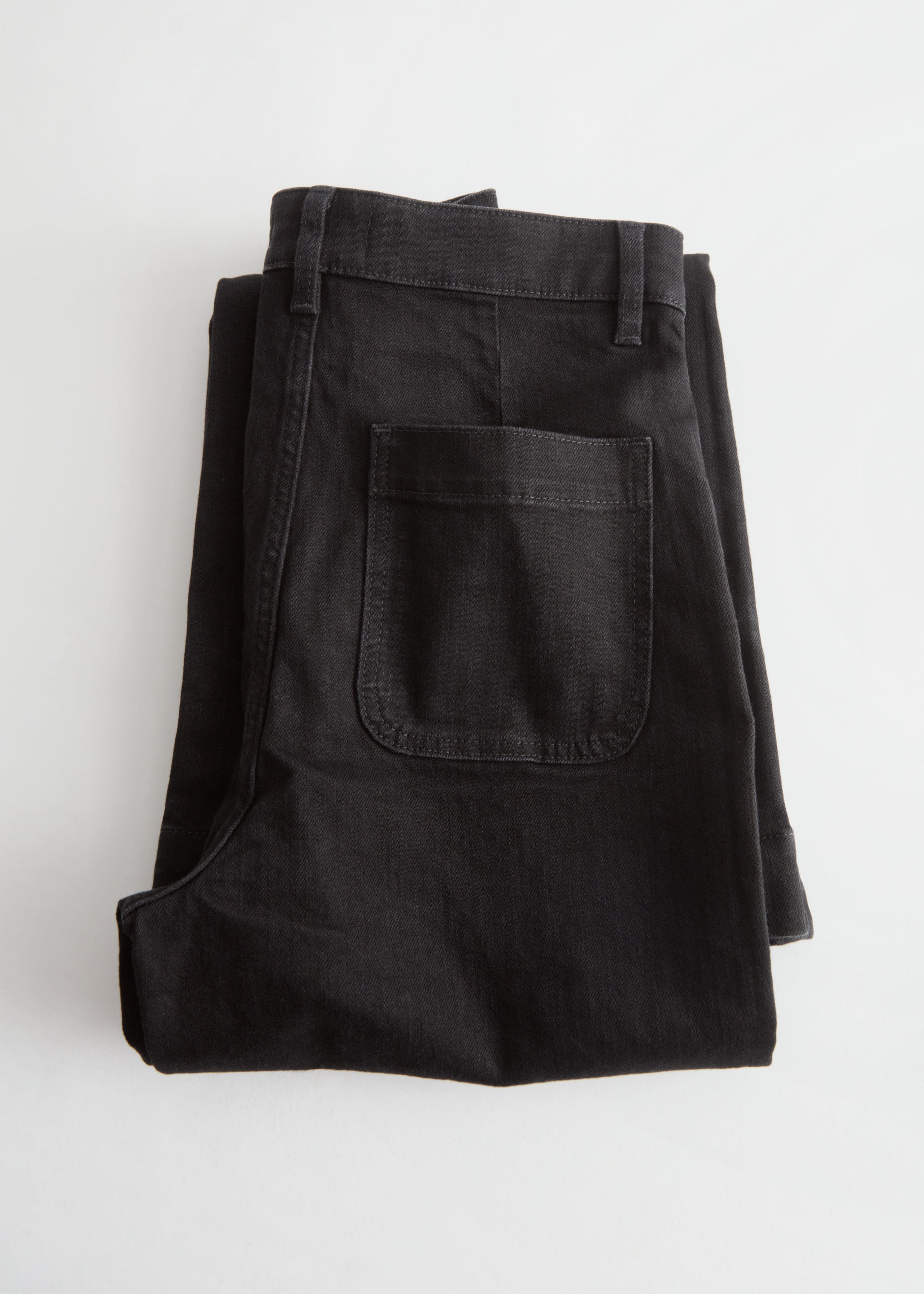 Ausgestellte Jeans mit Knöpfen - Schwarz - Stillleben