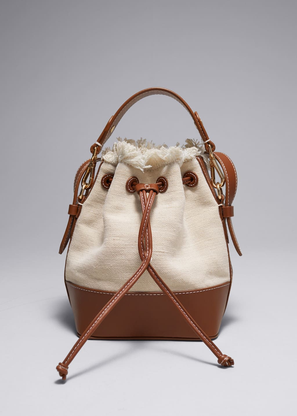 Bolso de lona con ribete de piel