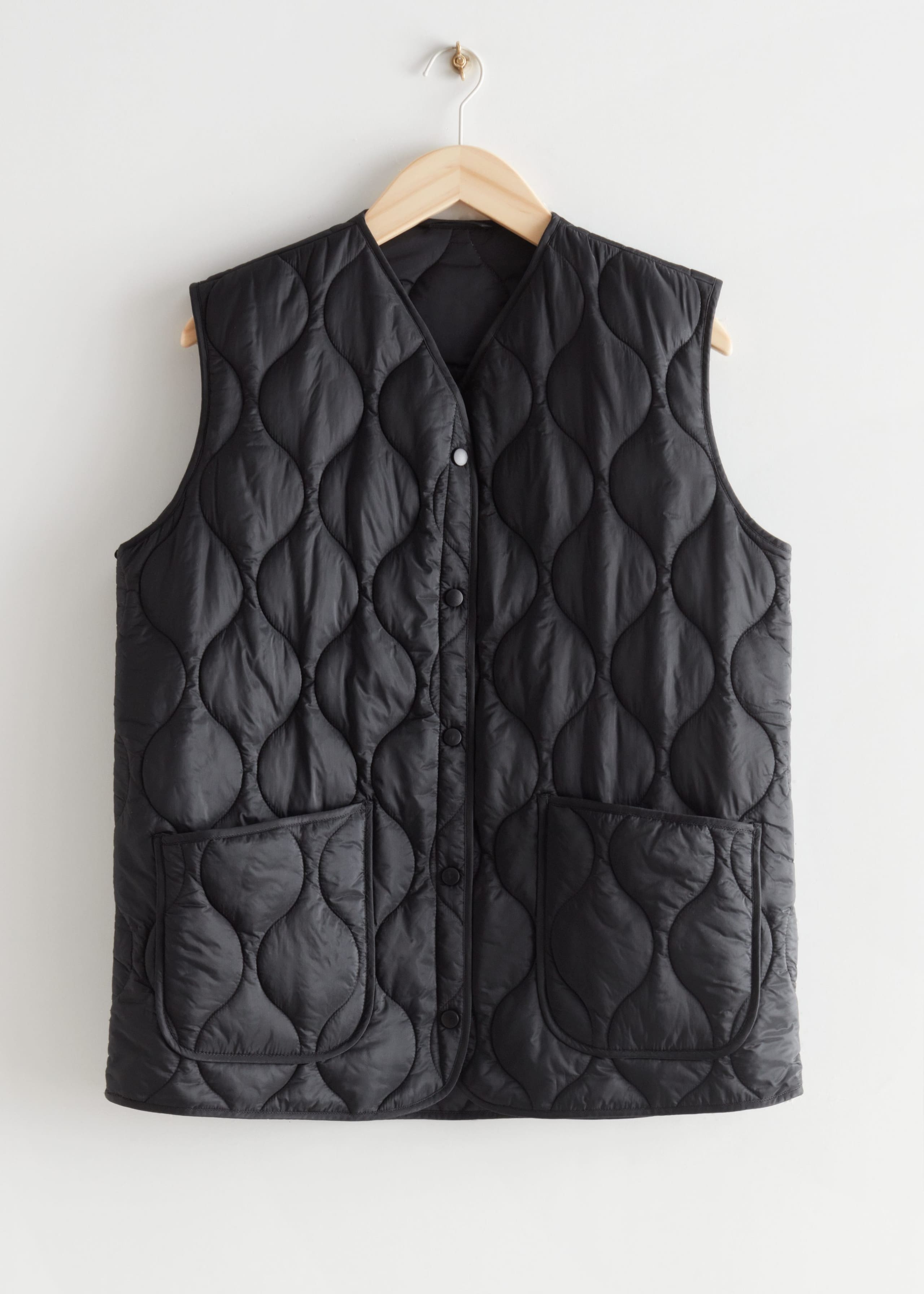 Buttoned Quilted Vest - Black - Natura morta