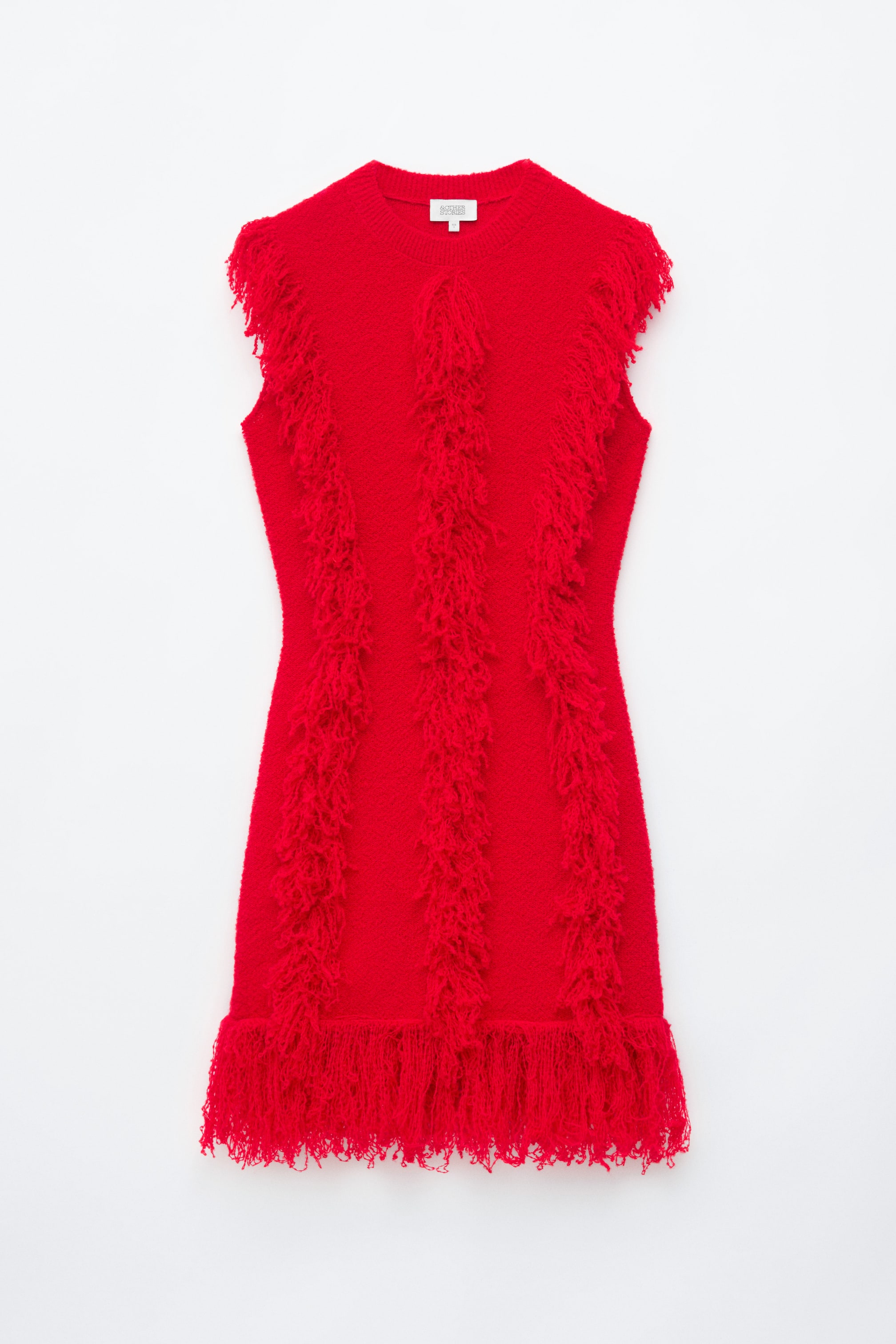 View larger image: A bright red, sleeveless knitted dress is shown from the front, featuring a round neckline and three vertical rows of shaggy fringe running down the body. A dense, longer fringe hangs from the hem of the slim-fit silhouette.