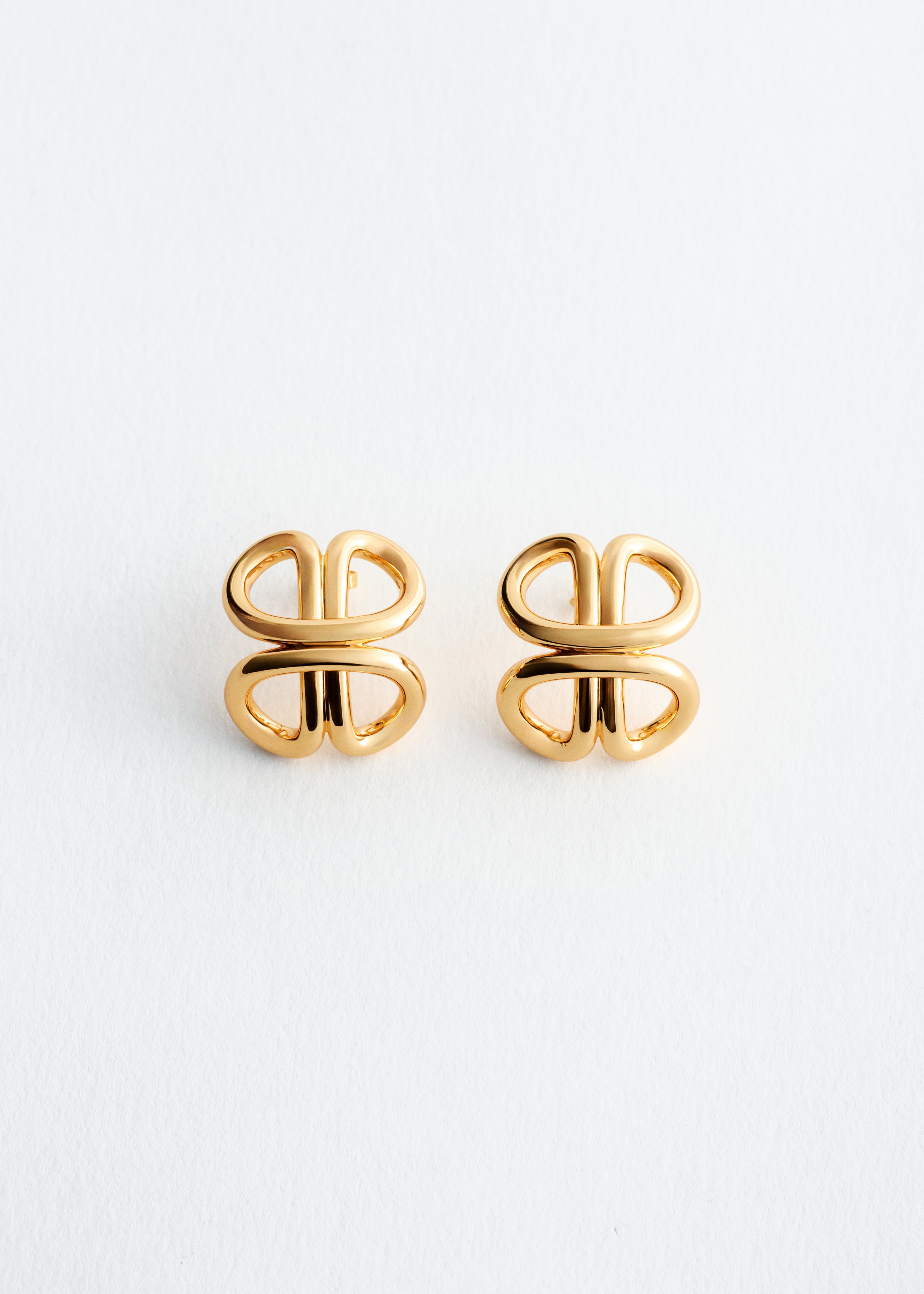 Interlocking Curve Stud Earrings - Gold