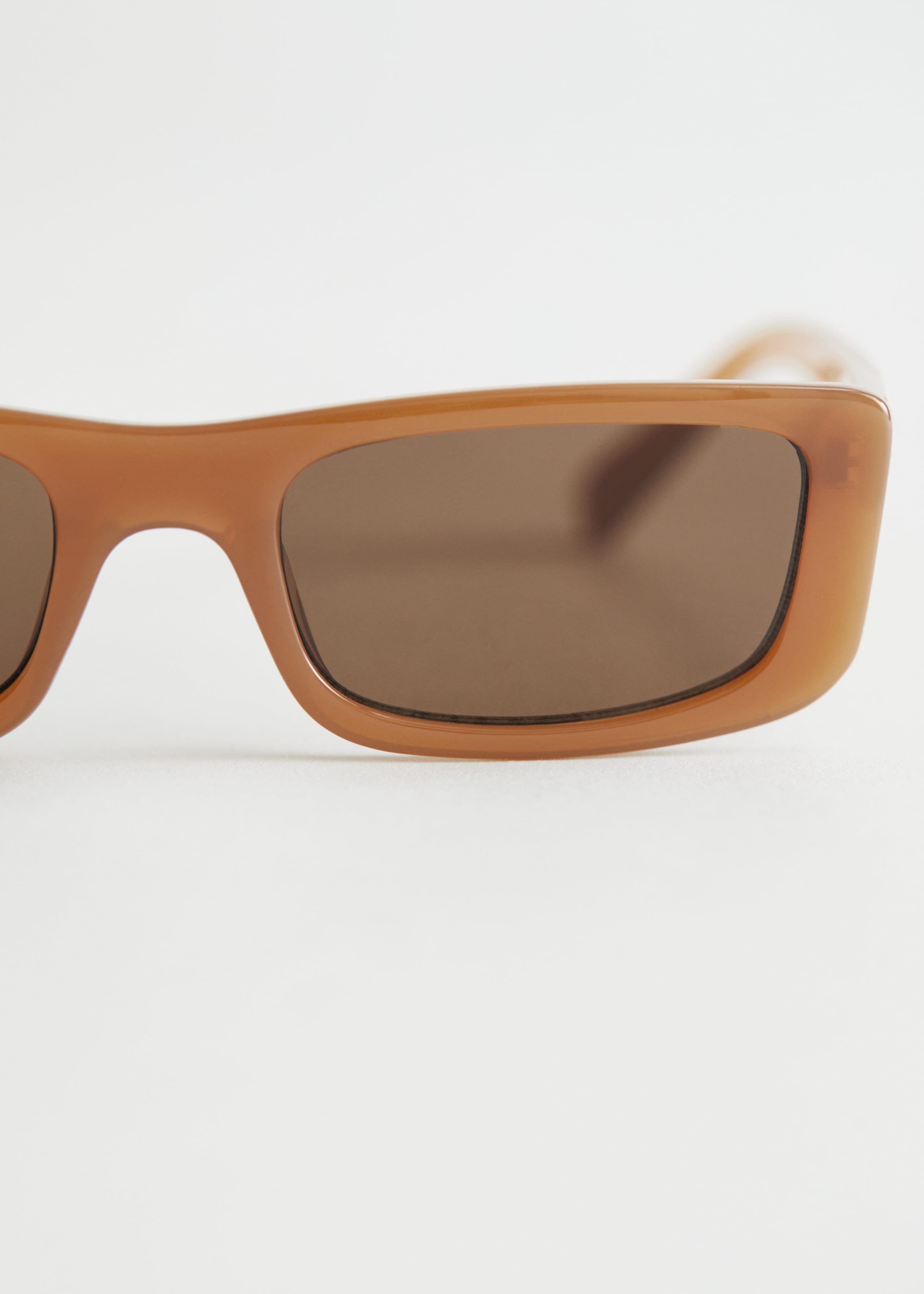 Oval Sunglasses - {{variantName}} - Descrizione dettagliata