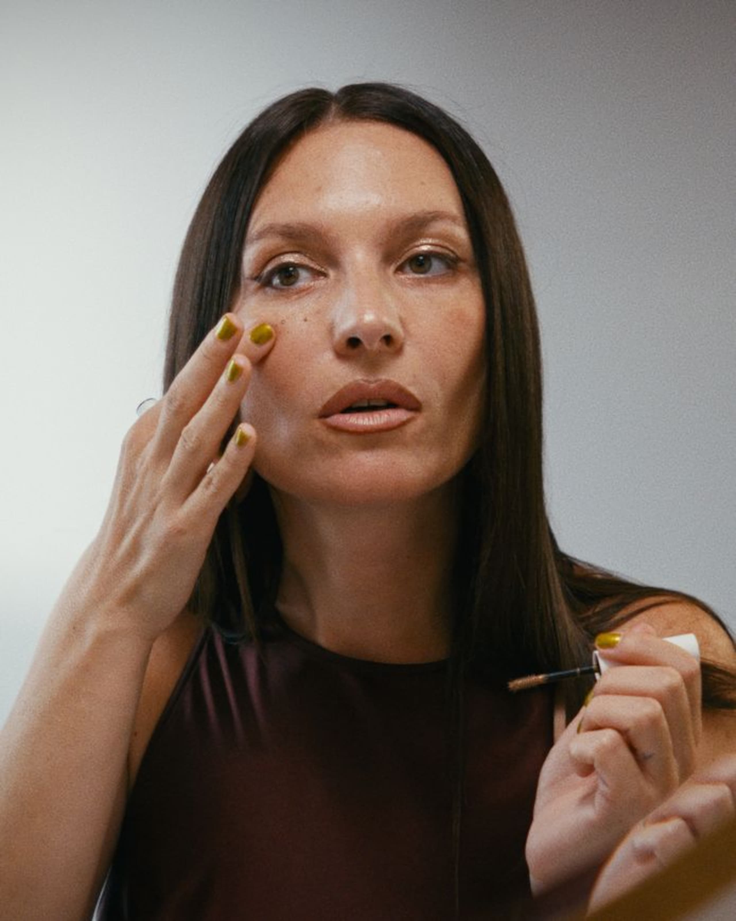 Woman putting on makeup